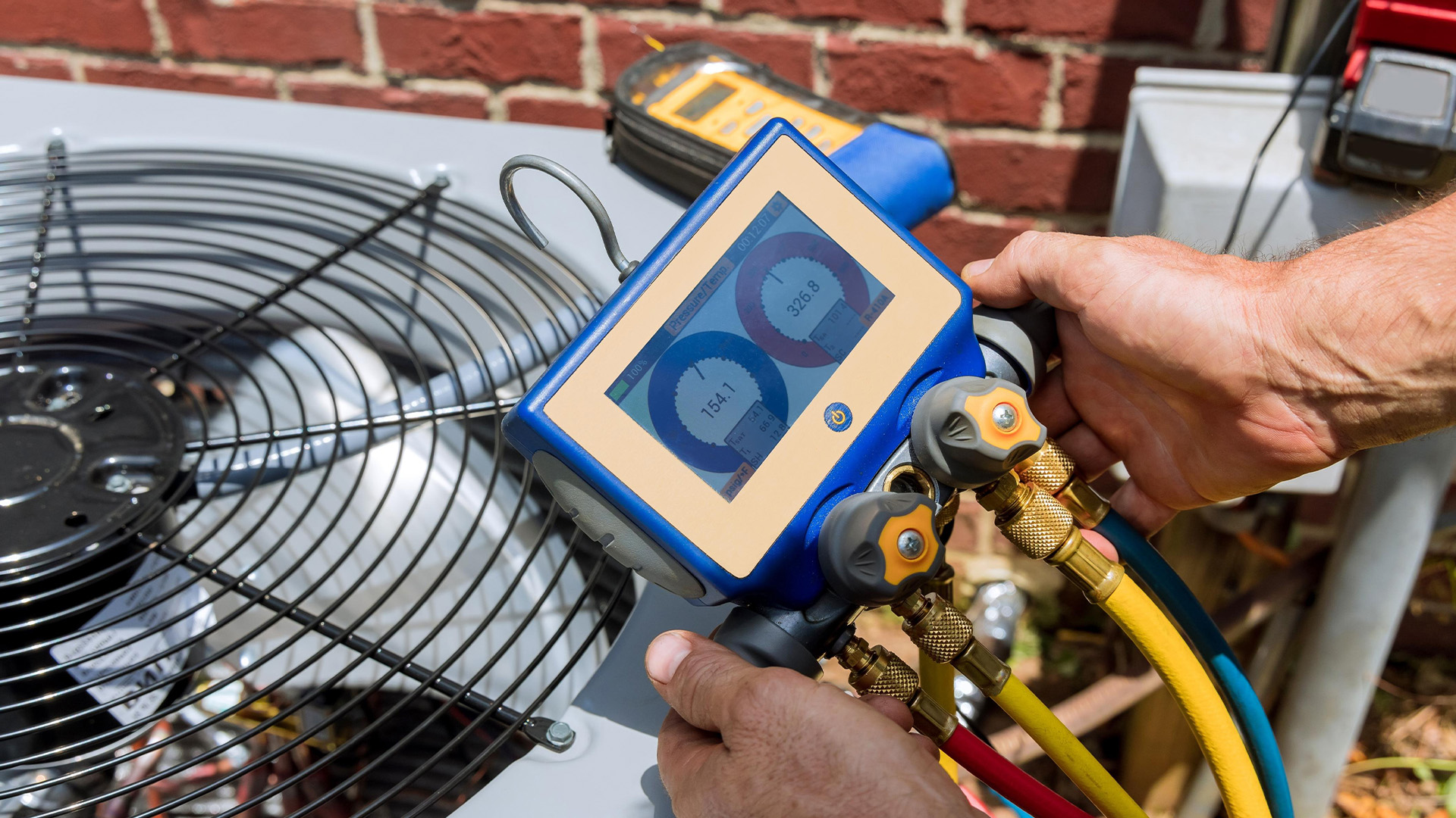Air conditioning unit being repaired